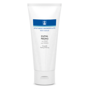 Weißer Tube mit blauer Schrift, die ein Enzym-Peeling mit Perlit und Papain bezeichnet.