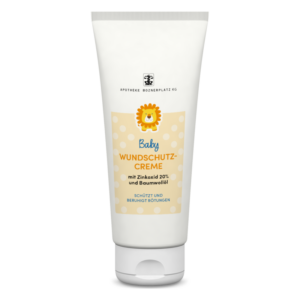 Tube mit Baby Wundschutzcreme, enthält 20% Zinkoxid und Baumwollöl, Verpackung in hellen Farben mit Löwenmotiv.