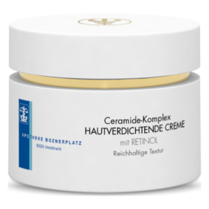 Eine weiße Dose mit einem goldenen Deckel, beschriftet mit 'Ceramide-Komplex HAUTVERDICHTENDE CREME mit RETINOL'.