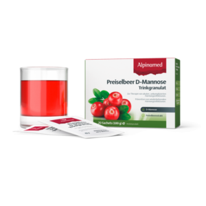 Verpackung von Preiselbeer D-Mannose Trinkgranulat mit einem Glas roten Getränks und einzelnen Sachets.