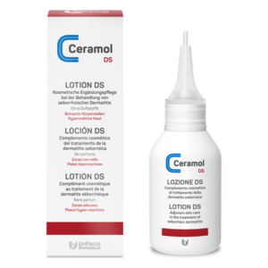 Ceramol DS Lotion in einer weißen Flasche mit einer spitzen Öffnung, neben einer mehrsprachigen Verpackung.