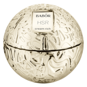 Runde, goldfarbene Cremedose von BABOR mit strukturiertem Design und einem Etikett "HSR cream rich".