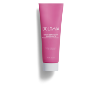 Regenerierende Reinigungscreme in einer pinken Tube mit weißen Verschluss, beschriftet mit "DOLOMIA".