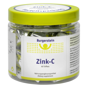 Durchsichtiger Kunststoffbehälter mit gelbem Deckel, gefüllt mit Zink-C Toffees von Burgerstein. Verpackungslabel sichtbar.