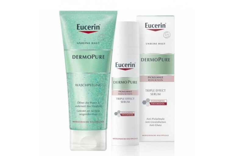Drei Eucerin Dermopure Produkte: Waschpeeling in Tube und zwei Flakons für das Triple Effect Serum zur Reduktion von Pickelmalen.