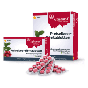 Preiselbeeren-Filmtabletten in Verpackungen, präsentiert mit roten, runden Tabletten in Blisterpackungen.