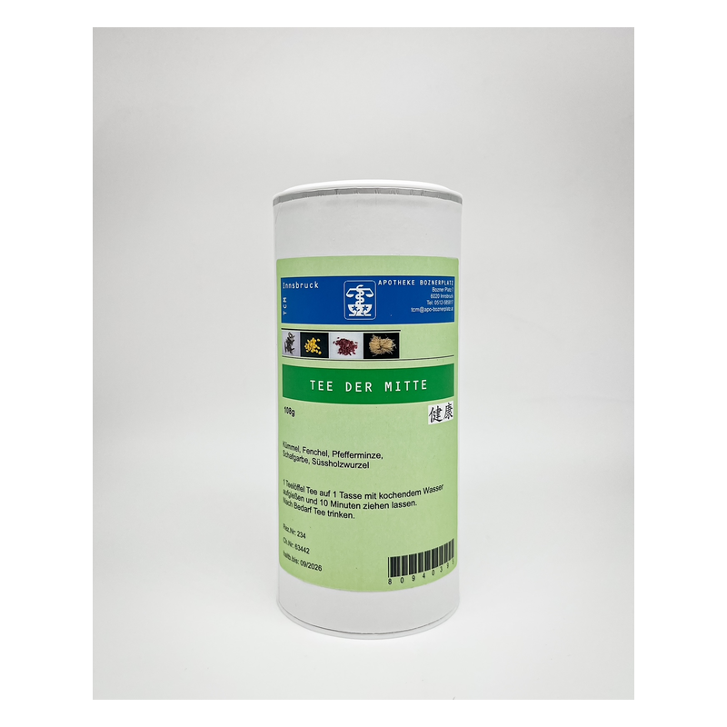 Runde Teebehälter mit grünem Etikett, auf dem steht 'Tee der Mitte', enthält verschiedene Kräuter.