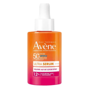 Flasche mit orangefarbenem Serum von Avène, schützt vor UV-Strahlen und enthält Hyaluronsäure und Niacinamid.